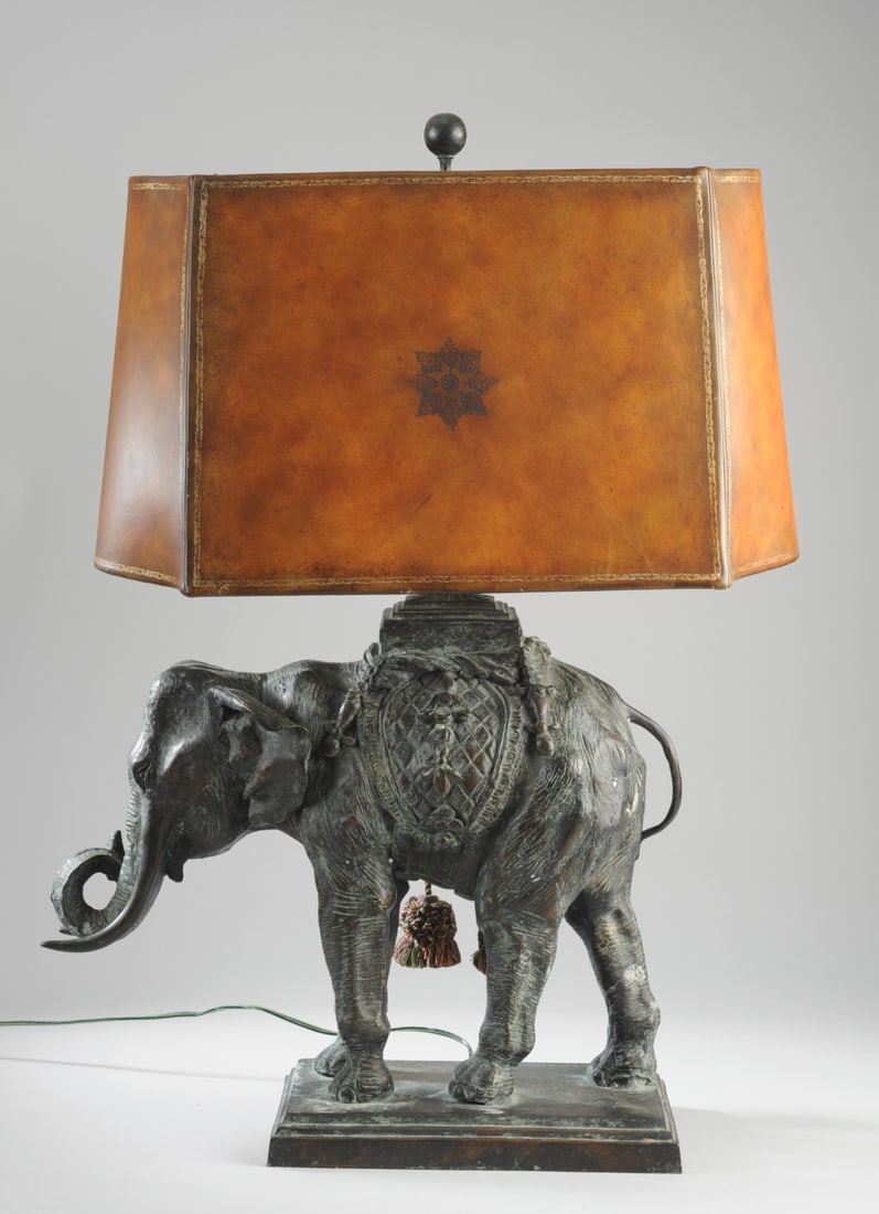 Maitland Smith Bronze Elephant Table Lamp: Patinated bronze with tooled leather shade. Height with shade 27", 19" from tip of tusk to tail, 7" wide. Our primary recommendation is to arrange shipping yourself using Blue Ridge Pack & Ship. Most
