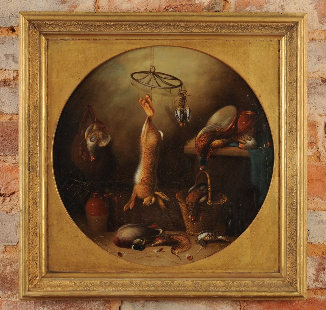 19th C. Nature Morte Painting: 19th century oil on canvas depicting a hare suspended from a hook, with pheasant, mallard, and assorted gamebirds arranged around a wicker basket and on a larder table. In period gilt frame. Faint scr