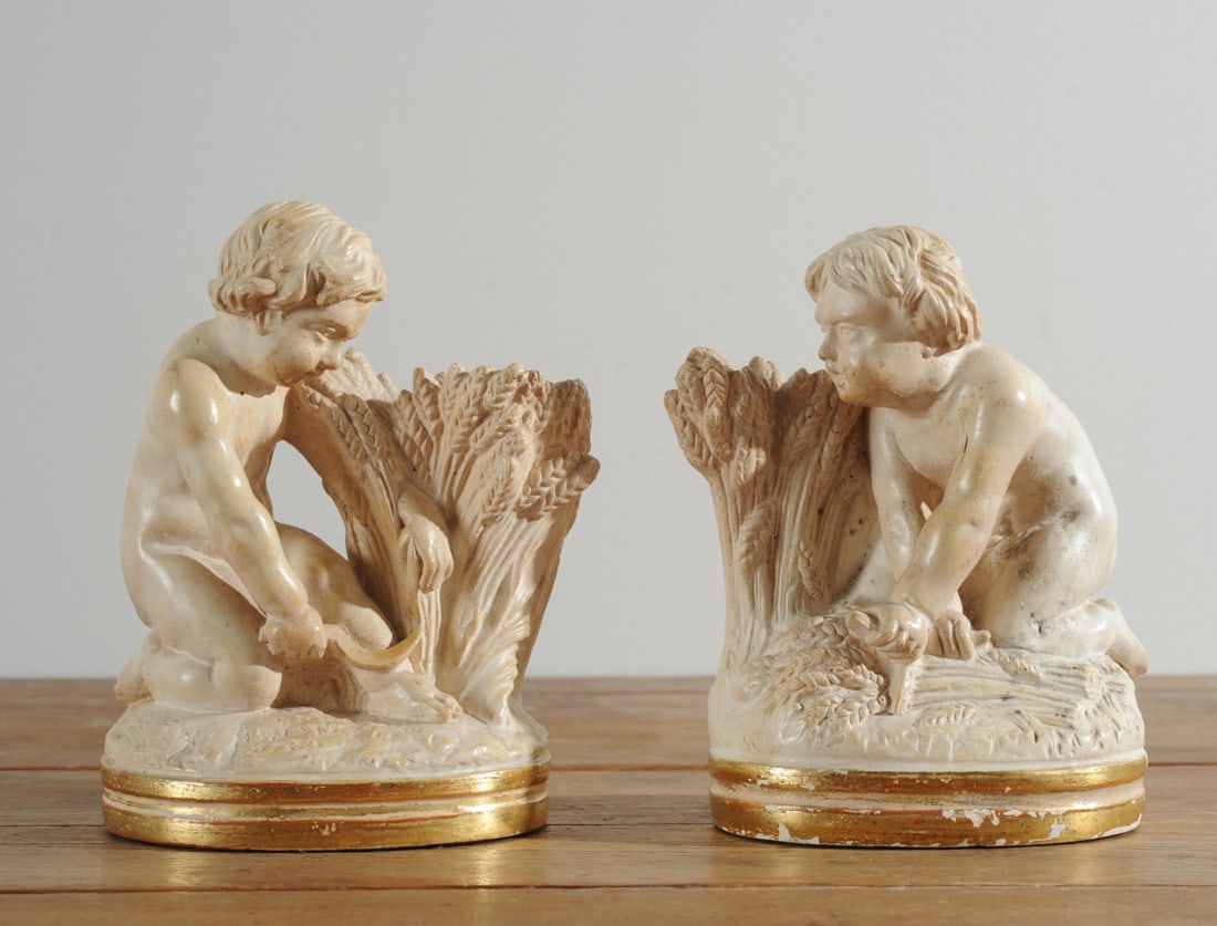 Vintage Borghese Putti Bookends: Ivory-white and gilt chalkware figures of cherubic children harvesting wheat. No tag but attributed to Borghese, c.1960s. . Approx. 7" H. Our primary recommendation is to arrange shipping yourself usi