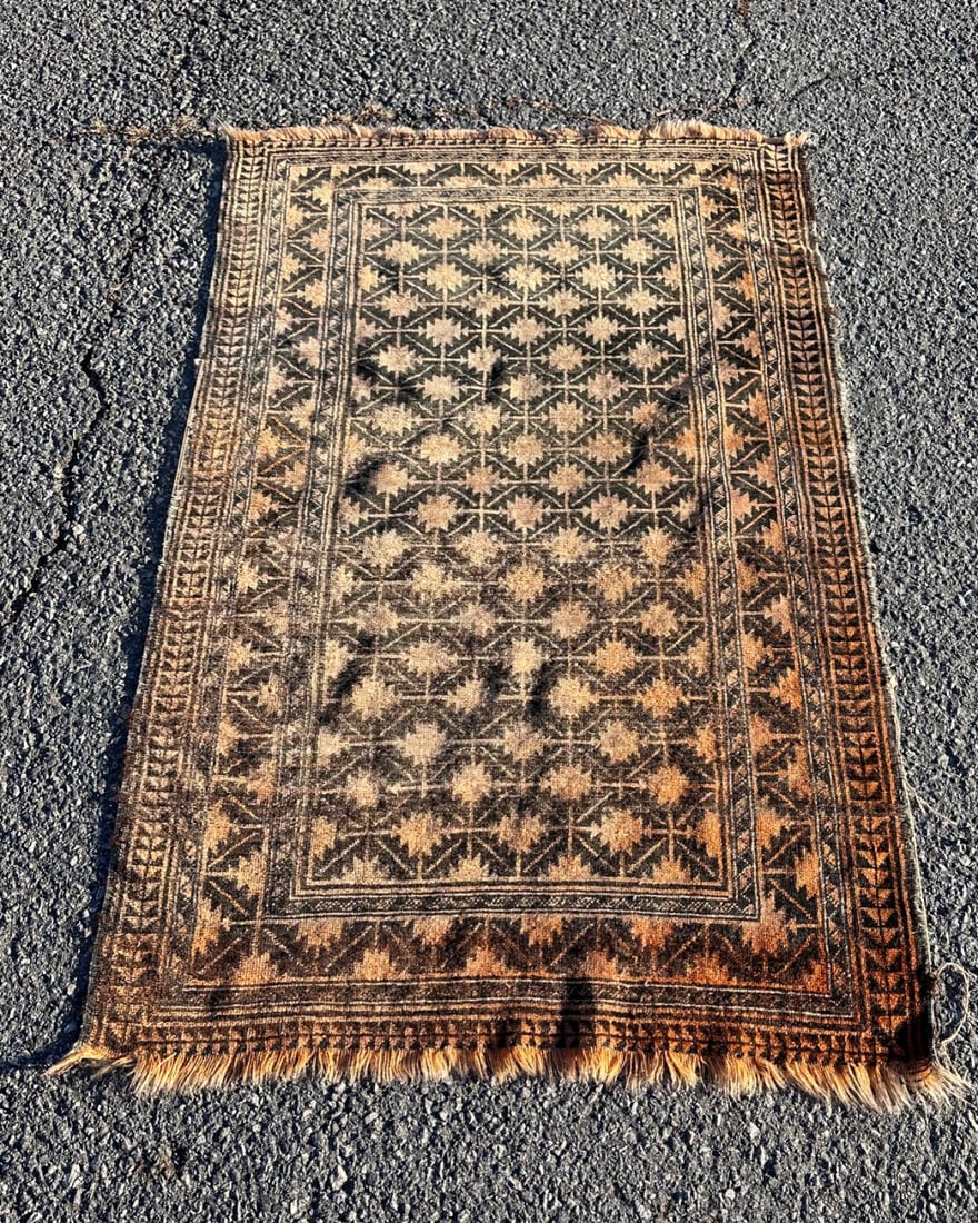 Vinatge Baluchi Rug: Dimensions approx. 4' 10" x 3' 1". Provenance: The estate of Alexander “Sandy” G. Gilliam, Jr. (1933 - 2024), distinguished University of Virginia administrator, historian, and advisor to four