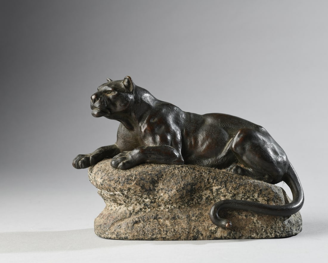 Clovis Edmond Masson (1838-1913, France): Bronze figure of a lioness, recumbent but alert on a granite rock. C. Masson incised into rock. Bronze with brown patina with granite. Approx. 7 1/2" L x 3 3/4" W x 5 1/2" H. Our primary recommendatio