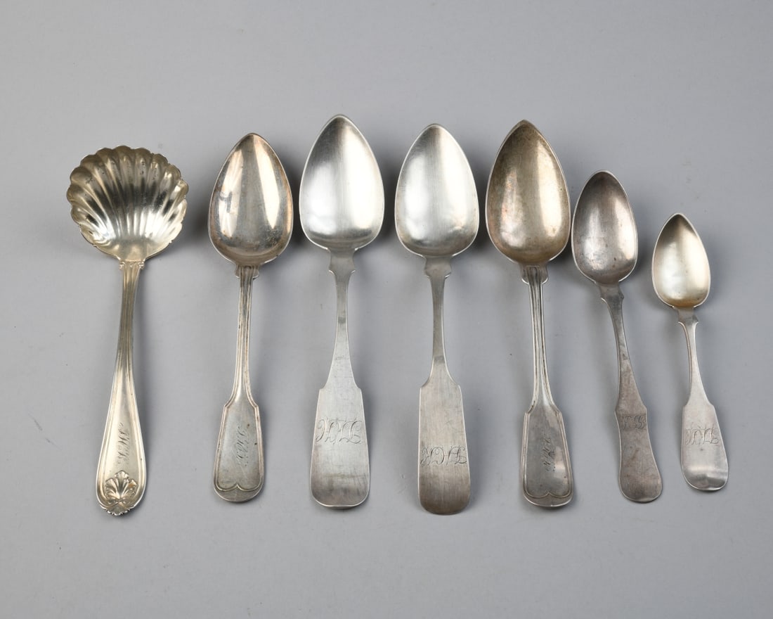 Coin Silver Mixed Grouping: Various makers and marks, seven pieces, all monogrammed. Longest: approx. 8 1/2". Total weight: approx. 10.01 ozt. Our primary recommendation is to arrange shipping yourself using Blue Ridge Pack & Sh