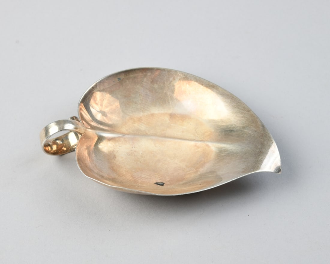 Tiffany & Co. Sterling Silver Leaf Dish: Marked to underside Tiffany & Co. Makers Sterling, no monograms. Approx. 5 1/2" x 4 1/8" x 3/4". Weight: approx. 3.76 ozt.Our primary recommendation is to arrange shipping yourself using Blue Ridge