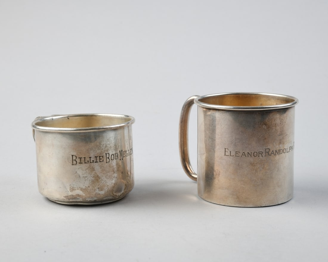 Two Sterling Silver Children's Mugs: Both inscribed, both marked sterling, some dings and dents. Tallest H: approx. 2 1/2". Total weight: approx. 4.43 ozt.Our primary recommendation is to arrange shipping yourself using Blue Ridge Pack