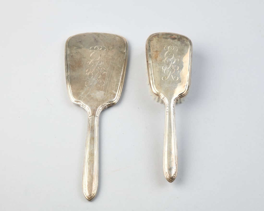 Antique Rogers Sterling Silver Mirror & Brush: Both monogrammed, some dings and dents, wear from age and use. Largest (mirror) approx. 11 3/4" x 4".Our primary recommendation is to arrange shipping yourself using Blue Ridge Pack & Ship. Most