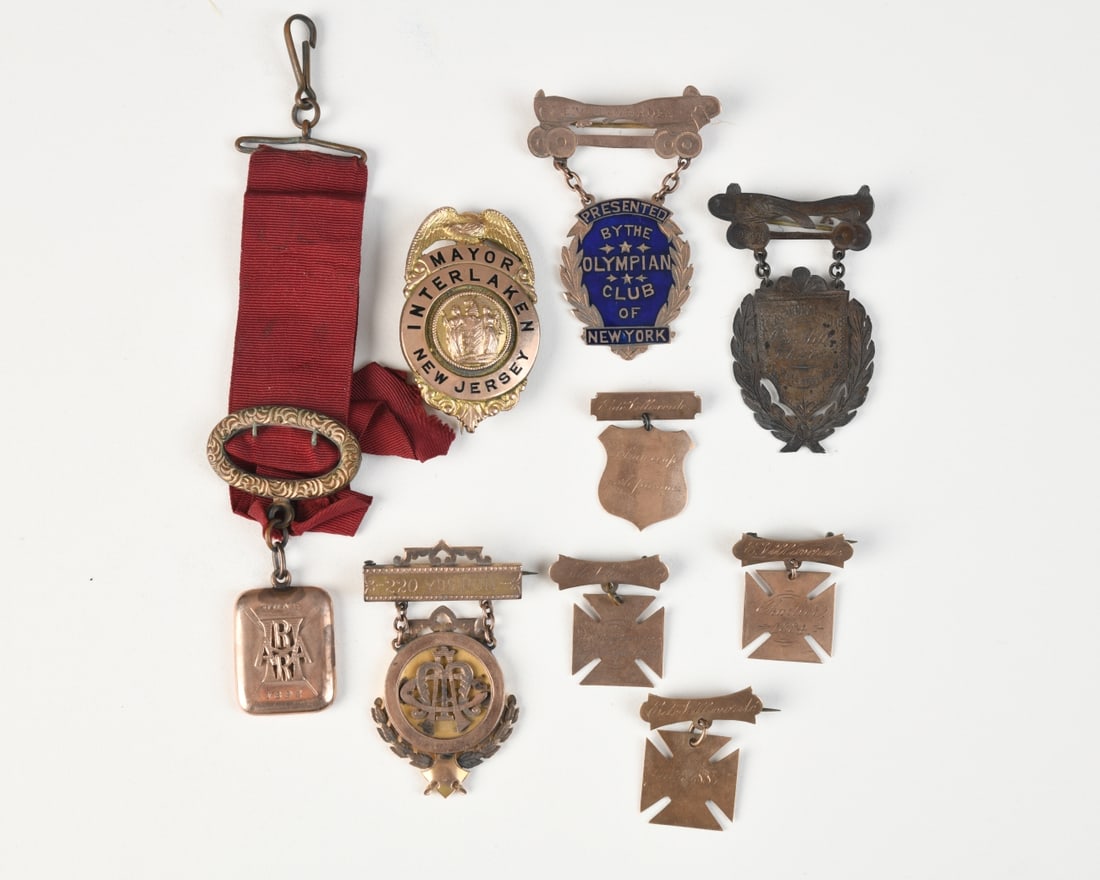 Group of American Rowing & Civic Medals: Nine medals and badges, mostly relating to late 19th / early 20th century rowing and athletic competitions, together with a “Mayor Interlaken, New Jersey” badge engraved to the reverse