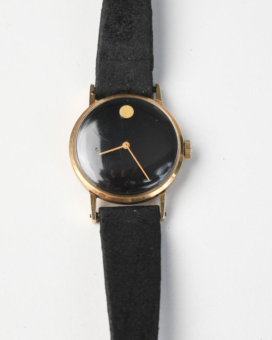 Vintage 14K Gold Dress Watch: Unmarked, the reverse stamped “14K Gold” with a stylized maker’s mark, enclosing a likely Swiss manual-wind movement (not inspected), circa 1960s - 1970s, with a later black leather Hirsch