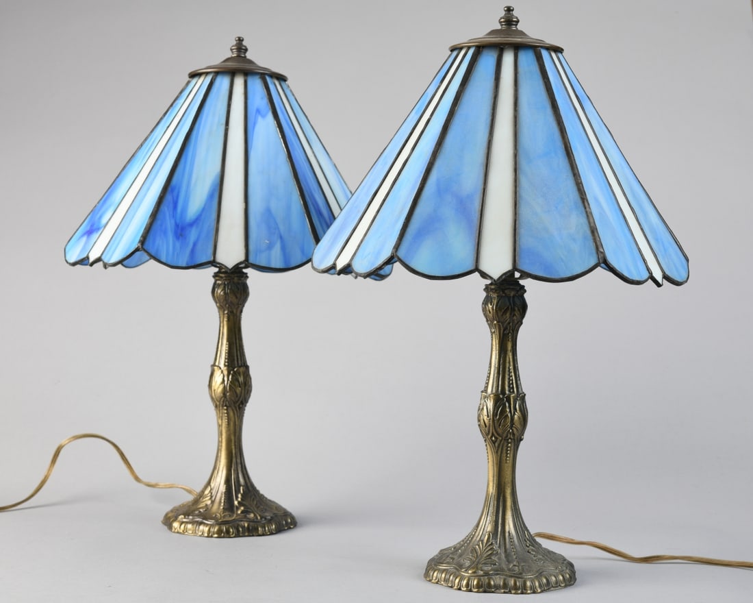 Pair of Vintage Tiffa-Mini Lamps: Two mid-20th century Art Nouveau-style “Tiffa-Mini” lamps with cast metal bases and decorative glass shades. Both power up, Some damage to glass. H: approx. 17". Our primary recommendation is