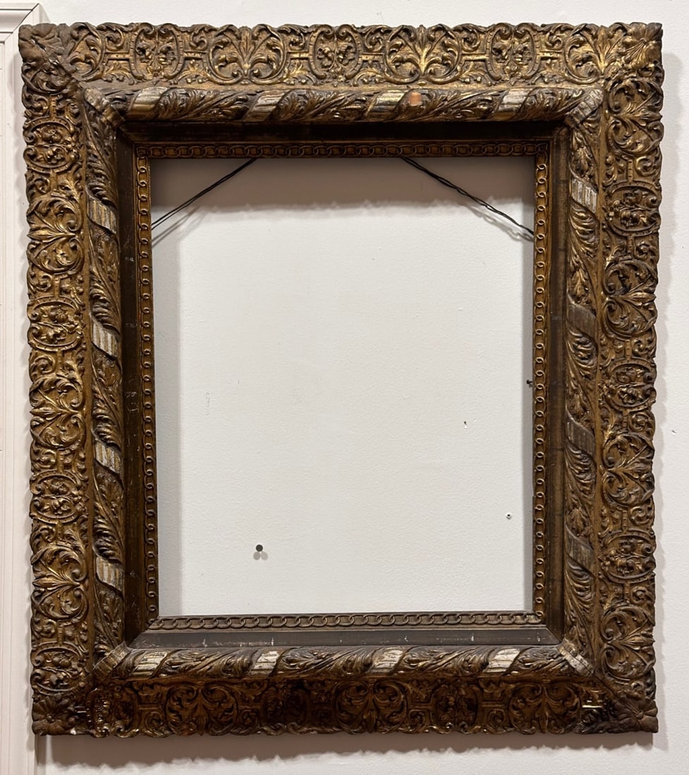 Late 19th C. Rococo Revival Picture Frame: With molded scrolling acanthus and floral ornaments, gilt surface with minor losses, cracks, and wear. Visible image: approx. 23 1/2" x 19 1/2". Frame: approx. 36 1/4" x 32 3/4". Our primary recommend