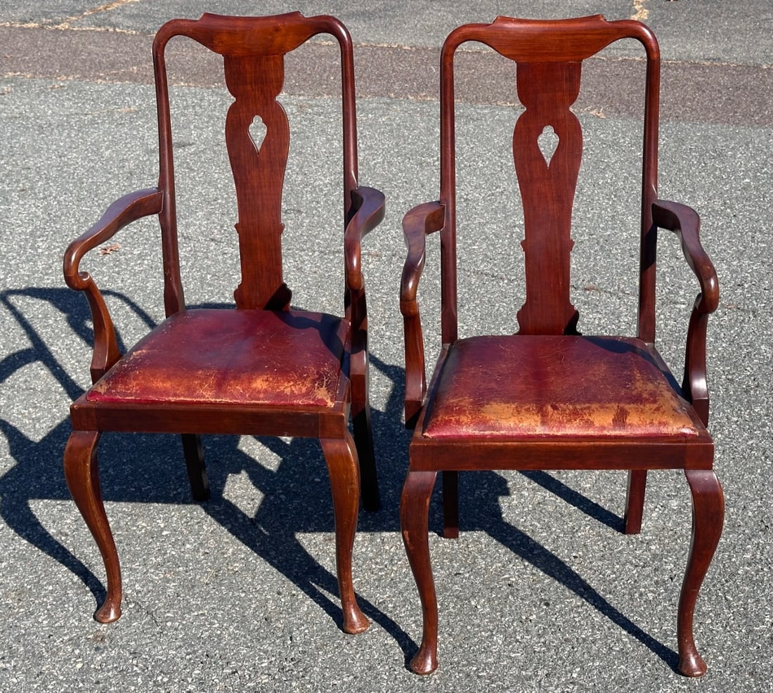 Two Late 19th C. Queen Anne Style Armchairs: Mahogany, with upholstered slip seats, shaped arms, cabriole legs and pad feet, wear to upholstery / in as-found condition. H: approx. 45". W: approx. 22 1/4". D: approx. 20".Our primary