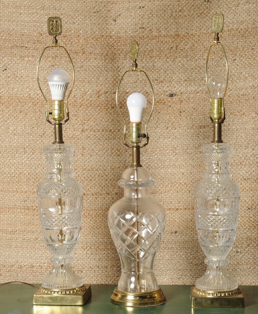Pair Mid 20th C. Glass Lamps +: With diamond point and scalloped patterns on baluster shaped bodies with brass bases, no visible maker's marks. Together with a single lamp with cross-hatched design, no visible maker's marks. All