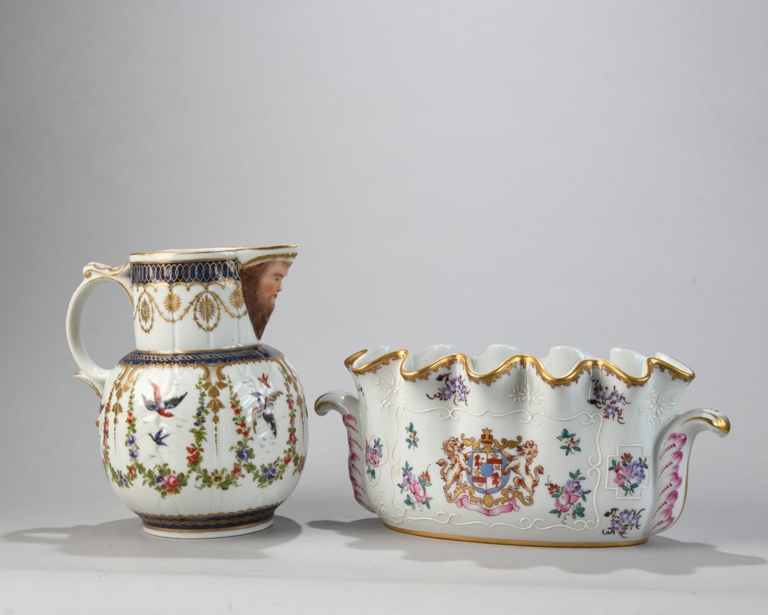 French Porcelain Ewer and Jardinière: Comprising a Samson porcelain ewer with figural mask spout and polychrome bird and floral decoration, together with a Porcelaine de Paris jardinière decorated with floral sprays, gilt accents, and ar