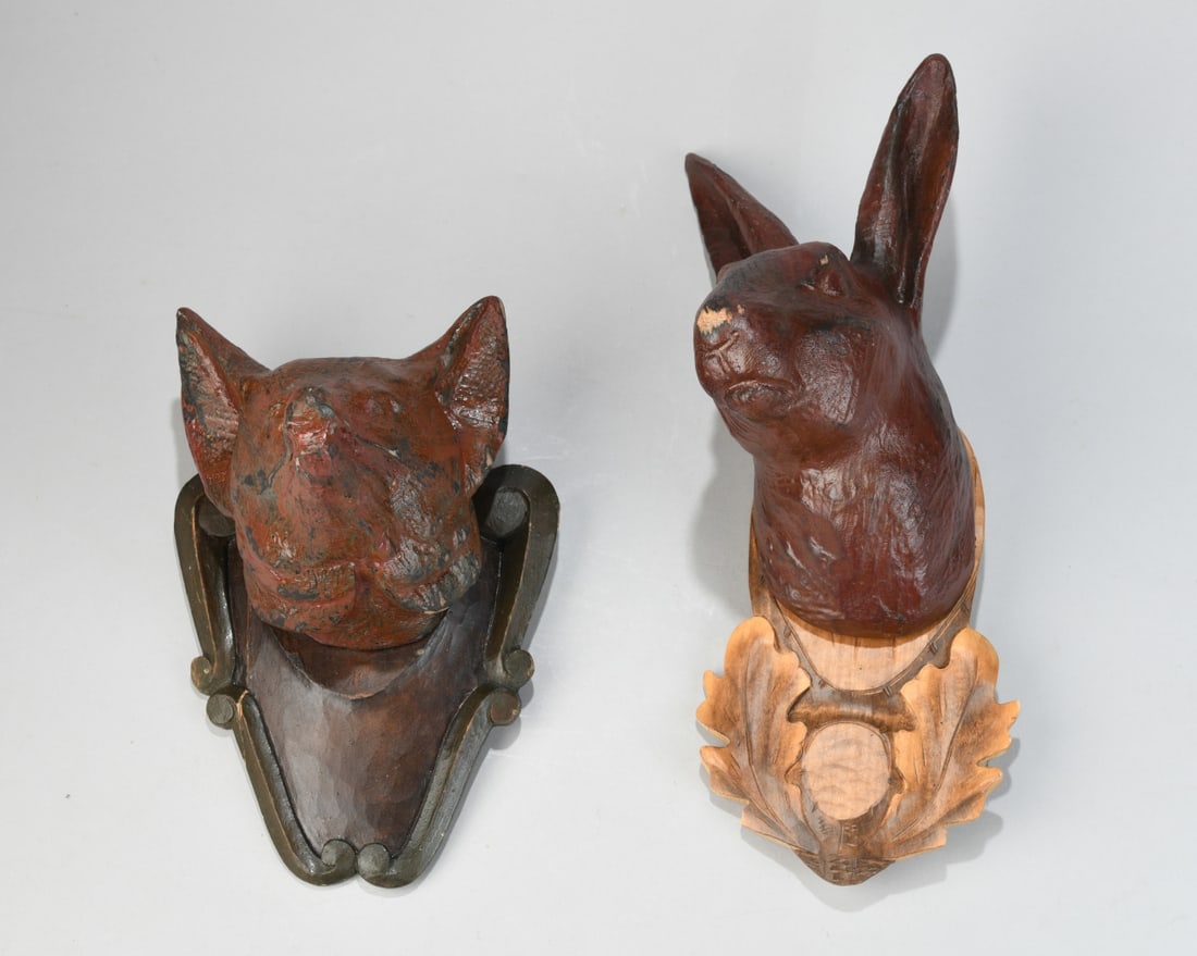 Wooden Animal Heads, Fox and Rabbit: Pair of painted carved wood animal head wall mounts, 20th century, stylized rabbit head on carved oak leaf plaque and a fox head on shaped backboard, rabbit with stamped mark to verso reading “REZBA