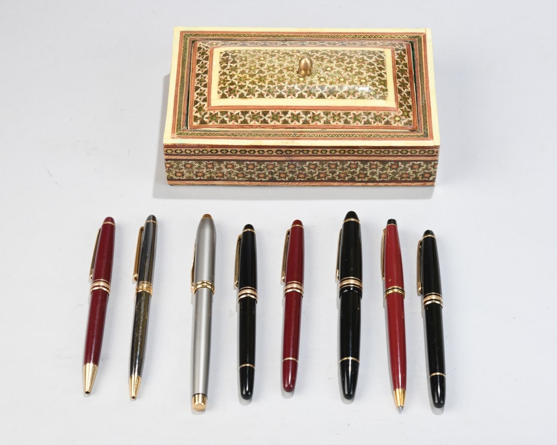 Eight Pens, Five Montblanc, with Inlaid Box: Including fountain pens and ballpoint pens, in black, burgundy, and silver finishes with gilt trim, together with a rectangular mosaic inlaid box with green velvet-lined interior. All in as-found cond