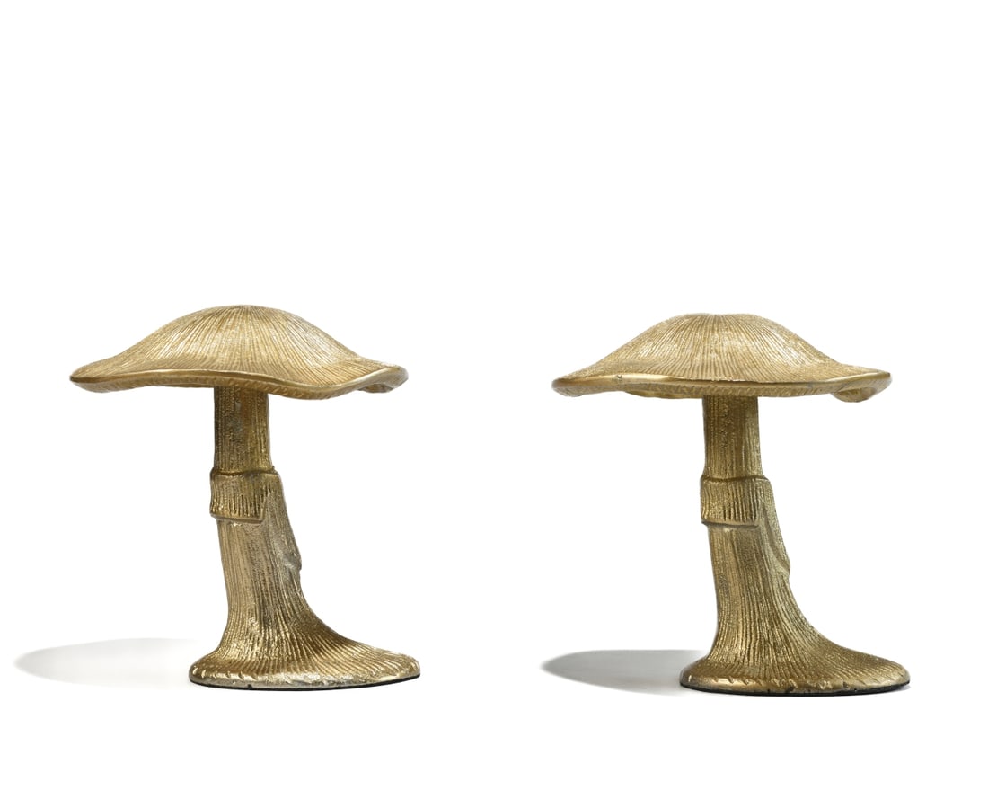 Pair of Decorative Cast Metal Mushrooms: Modeled as a stylized mushroom with radiating gill texture to the cap and fluted stem, no visible maker's marks, late 20th century. Dimensions approx. 6" x 5 1/2". Our primary recommendation is to