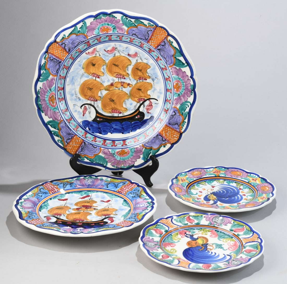 Four Hand-Painted Greek Plates: One large scalloped charger, one smaller plate with a galleon motif, and two plates with stylized bird motifs (one with small rim chip), all in bright polychrome decoration; undersides variously inscr