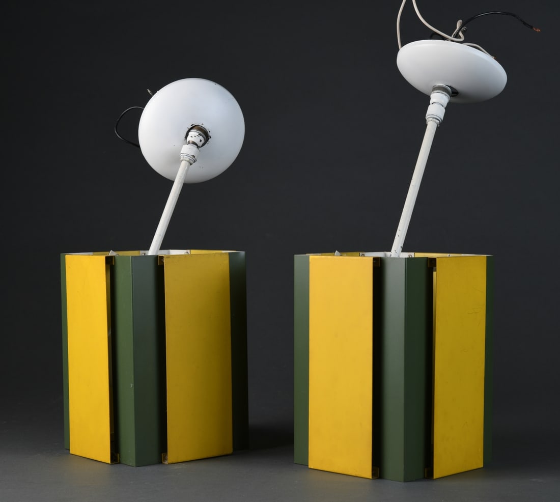 Pair of Mid-Century Modern Hanging Light Fixtures: Rectangular form with layered sheet metal shades in painted green and yellow, enclosing single sockets; suspended from rods with ceiling canopies present; unmarked. Likely mid 20th century manufacture
