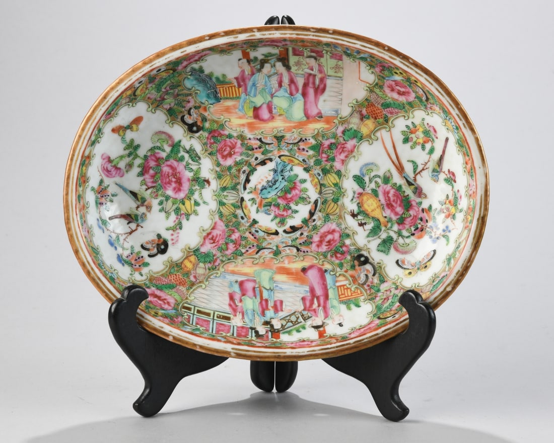 Chinese Qing Dynasty Shallow Porcelain Bowl: In famille rose enamels, Canton, mid / late 19th century, decorated with alternating reserves of courtly figural scenes and floral sprays with birds and butterflies, the interior centered by a floral 
