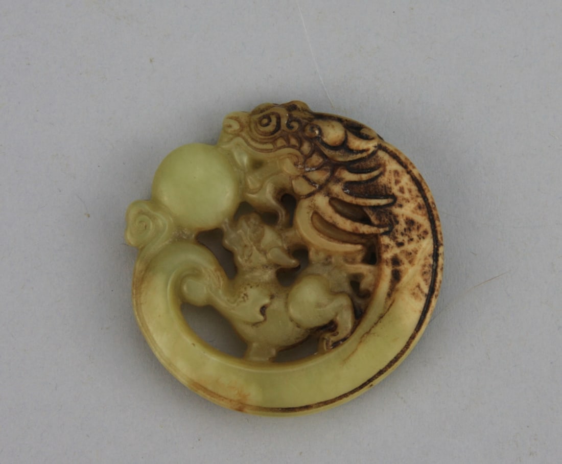 Chinese Carved Jade Circular Pendant: Chinese carved jade circular pendant depicting a dragon chasing a flaming pearl over a qilin. 2 18" diameter. Our primary recommendation is to arrange shipping yourself using Blue Ridge Pack & Ship. M