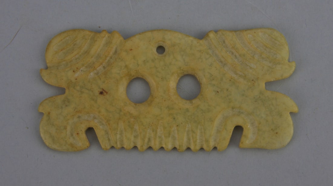 Chinese Carved Yellow & Green Jade Pendant: Chinese carved yellow and green mottled jade cloud comb pendant. Light wear and minor surface abrasions. 3 1/2" long. Our primary recommendation is to arrange shipping yourself using Blue Ridge Pack &