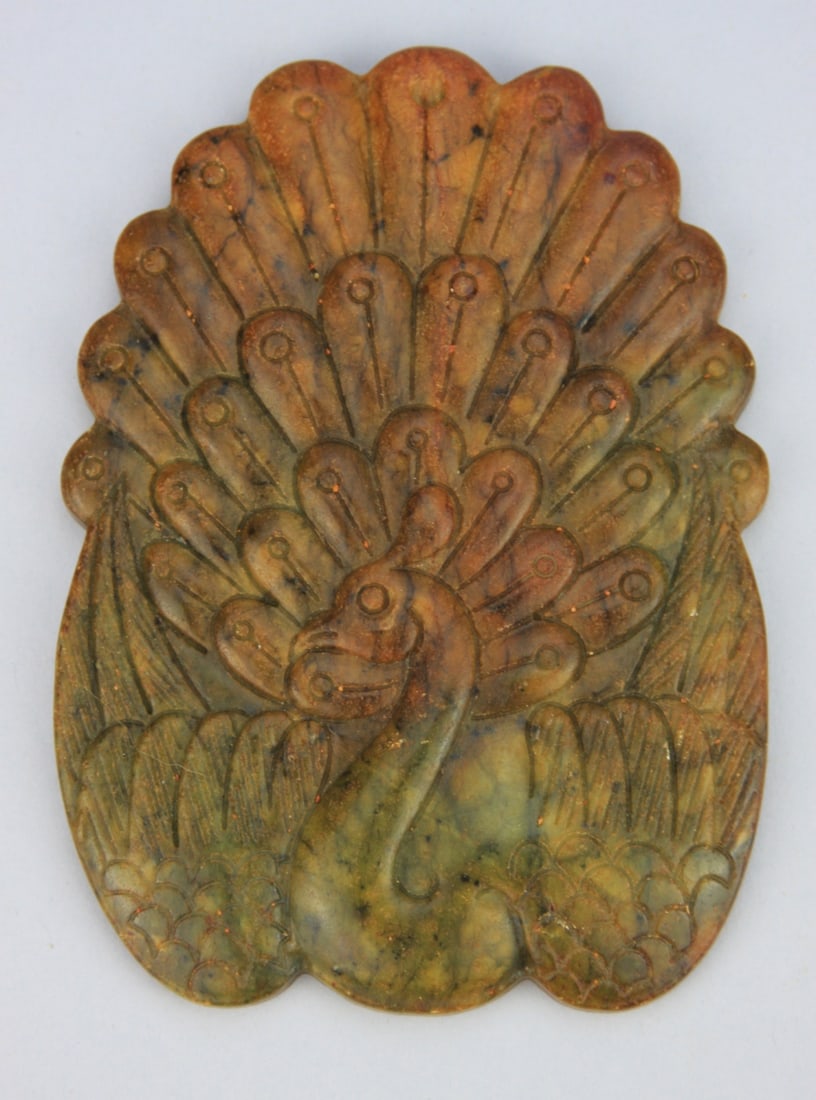 Chinese Carved Hardstone Peacock Plaque: Chinese carved yellow green and russet mottled carved hardstone placque of a peacock. Probably Xiyuan jade which is considered a jade in China. It is not nephrite or jadeite. 5 1/4" in lenght, 4" wide