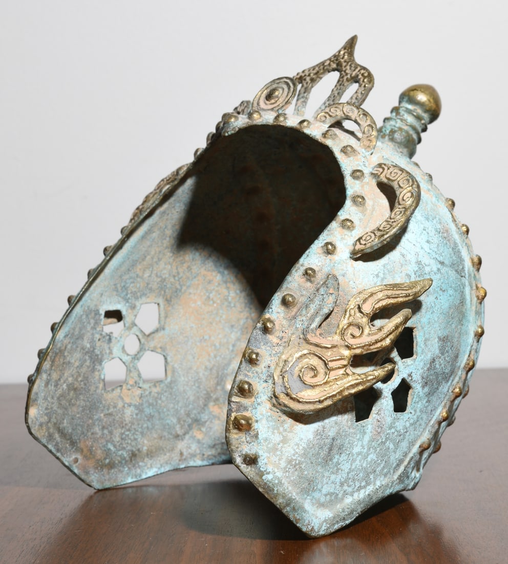 Cast Metal Ritual Crown Fragment: Probably Himalayan (Tibet or Nepal), gilt copper alloy with green patina, openwork and applied bosses, the domed form with lotus-like crest and finial knop, pierced and incomplete, lacking its origina