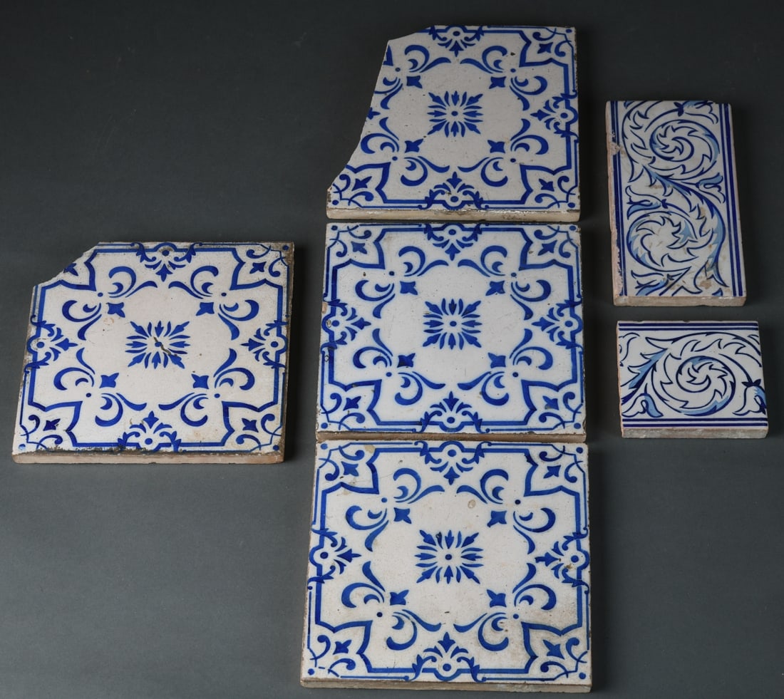 Six Iberian Style Blue & White Tiles: Likely Spanish or Spanish Colonial revival, each earthenware tile with cobalt blue foliate and geometric decoration on a white ground, including five square examples and one rectangular border tile, p
