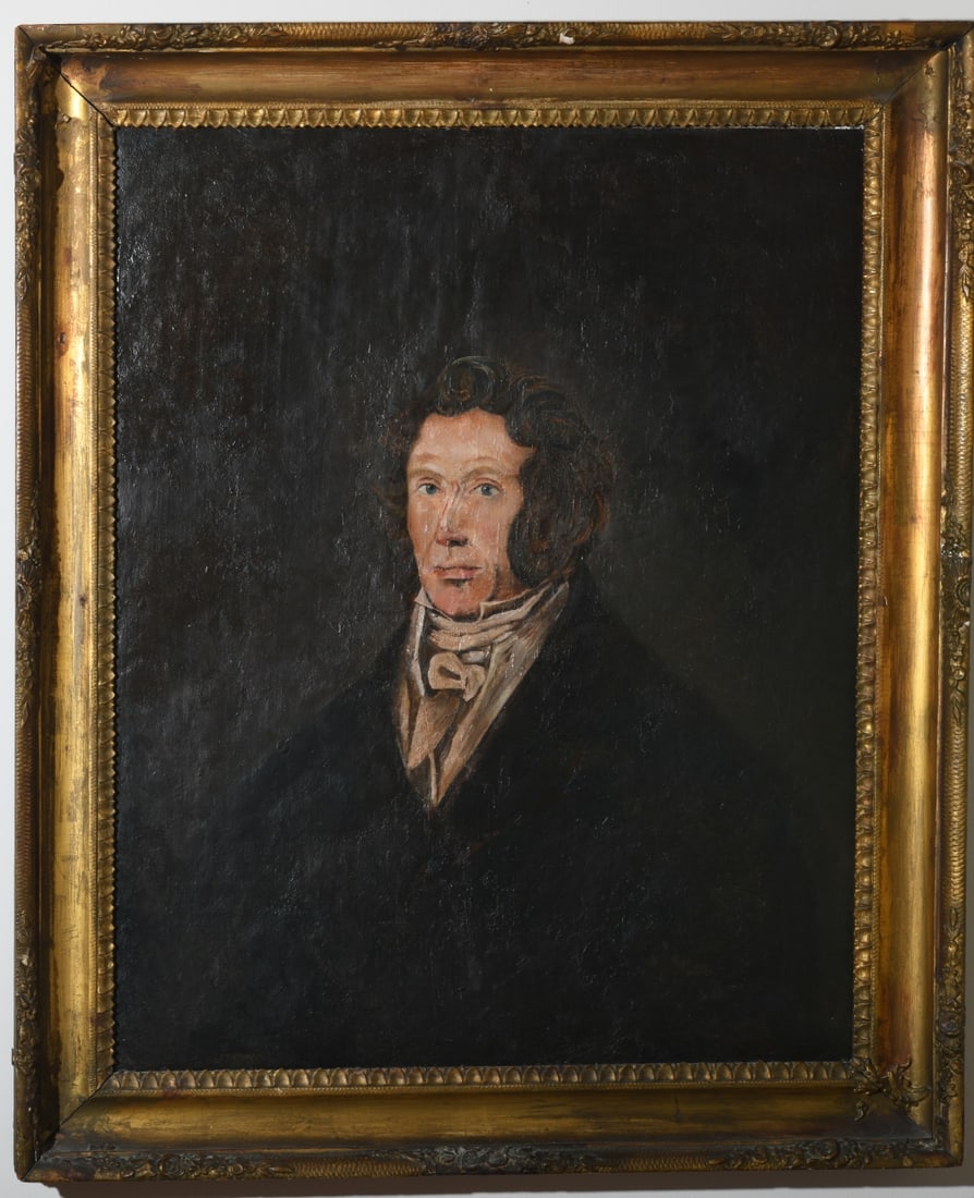 Antique Oil on Canvas Portrait of a Gentleman: Unsigned oil on canvas, 19th century or later, depicting a gentleman in black coat and white cravat against a dark ground, housed in a gilt molded frame. Visible craquelure and surface wear