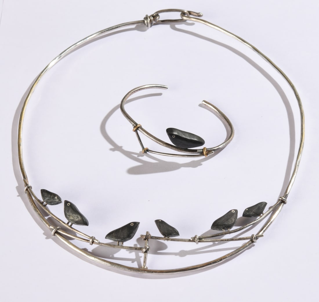Carolyn Morris Bach Choker Necklace and Bracelet: Matching sterling choker necklace and cuff bracelet featuring black birds in the design. Necklace L: approx. 7 3/4" from top to bottom. Bracelet: approx. 2 5/8" across. Our primary recommendation is
