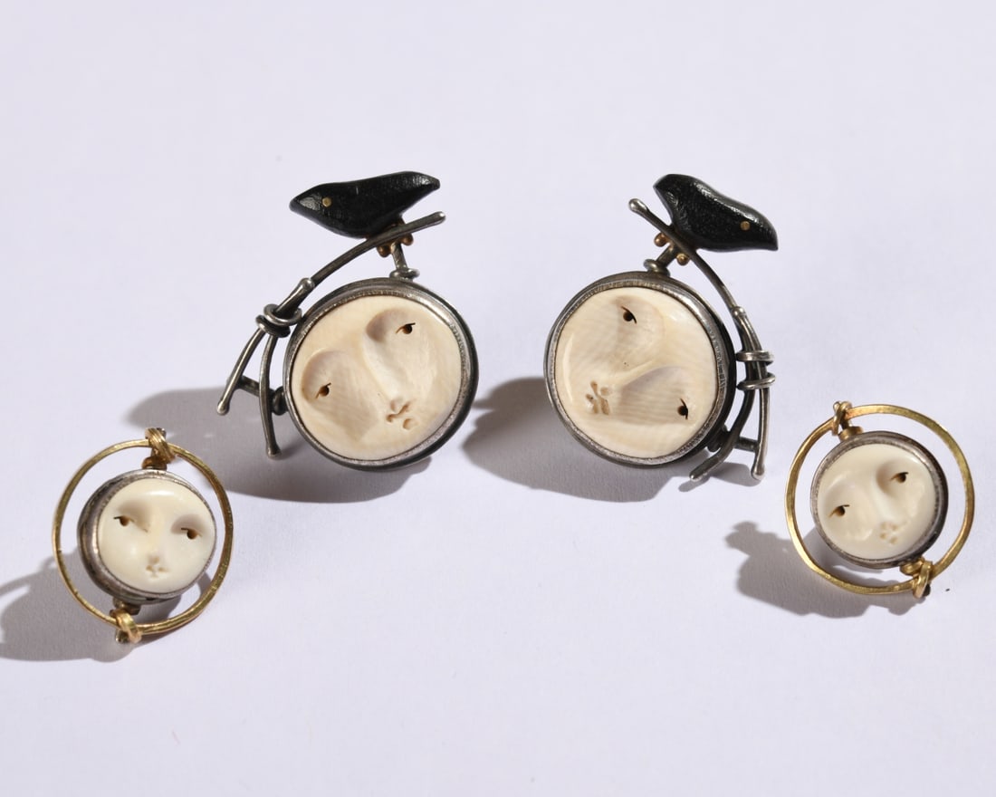 Carolyn Morris Bach Earrings, Two Pair: Two pair of earrings, the larger pair with carved bone face and black birds, signed and dated 2012 to verso and marked "Sterling 18k", the smaller pair with carved bone face, signed and dated 2013 to