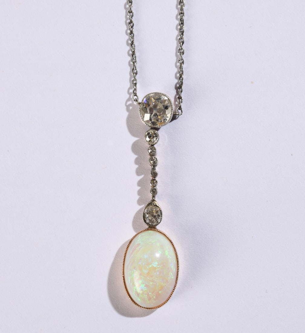 Opal Platinum Gold & Diamond Pendant Necklace: Antique, approx. 13 old cut diamonds, opal top, platinum chain, gold-filled clasp, yellow gold back, platinum-topped setting. L: pendant including diamonds: approx. 1 1/2". Total weight: approx. 5.72
