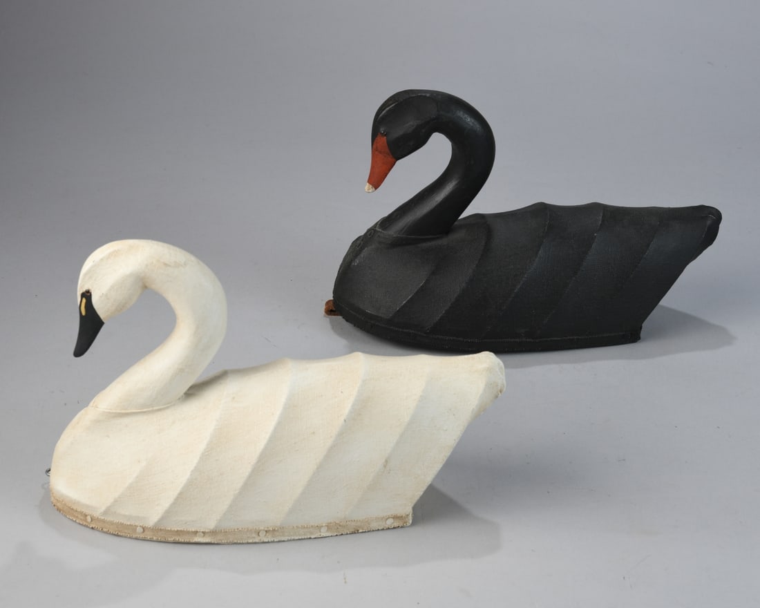 Pair of Canvas Bodied Swans: Marked WM (William Moseley, 1925 - 2015) to undersides. Approx. 13" x4 3/4" x 7 1/2". Our primary recommendation is to arrange shipping yourself using Blue Ridge Pack & Ship. Most bidders find this