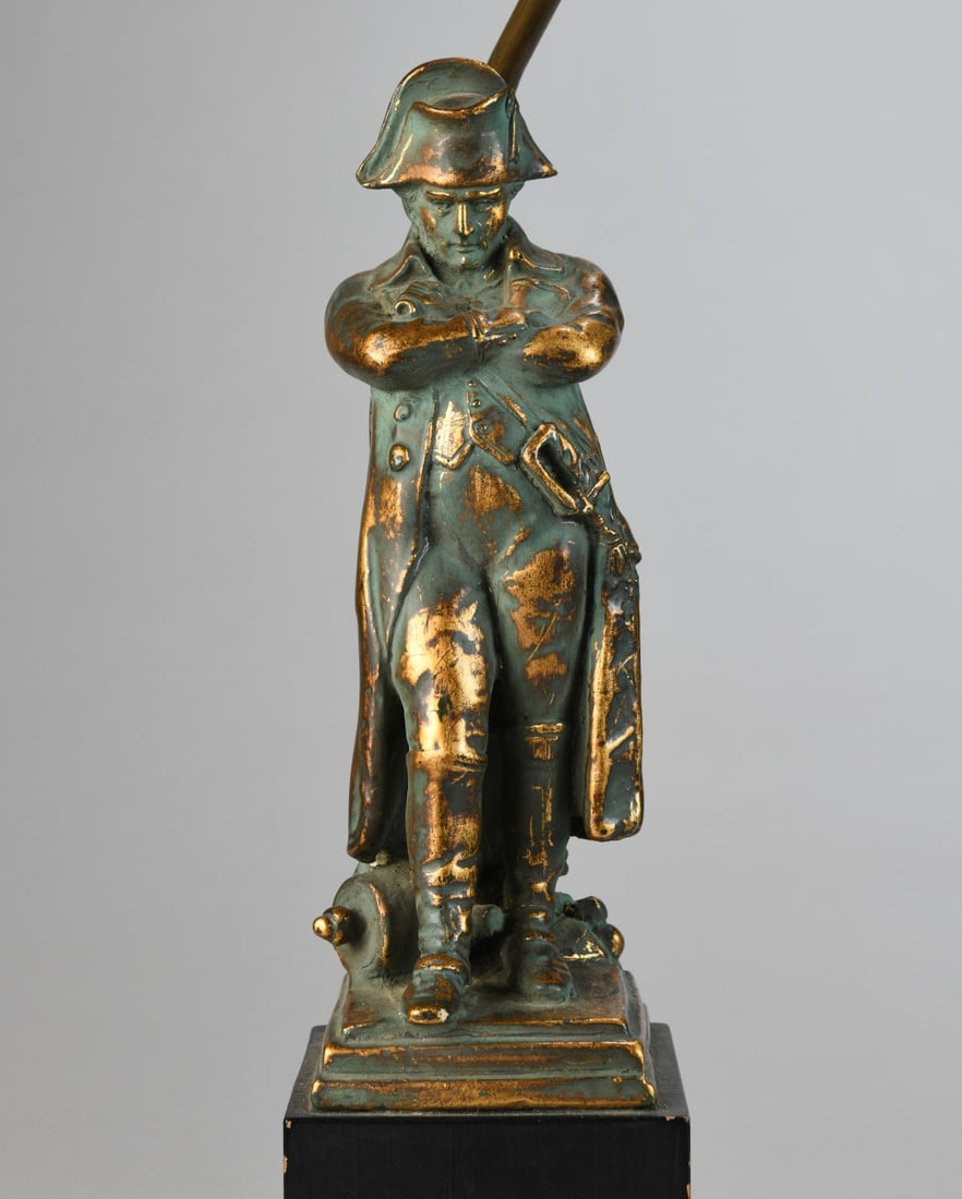 Napoleon Figural Table Lamp: Carved or molded wood / composition figure depicting Napoleon Bonaparte standing with arms crossed, finished in simulated bronze tone, mounted on a square base. Figure detached from base. Powers on.