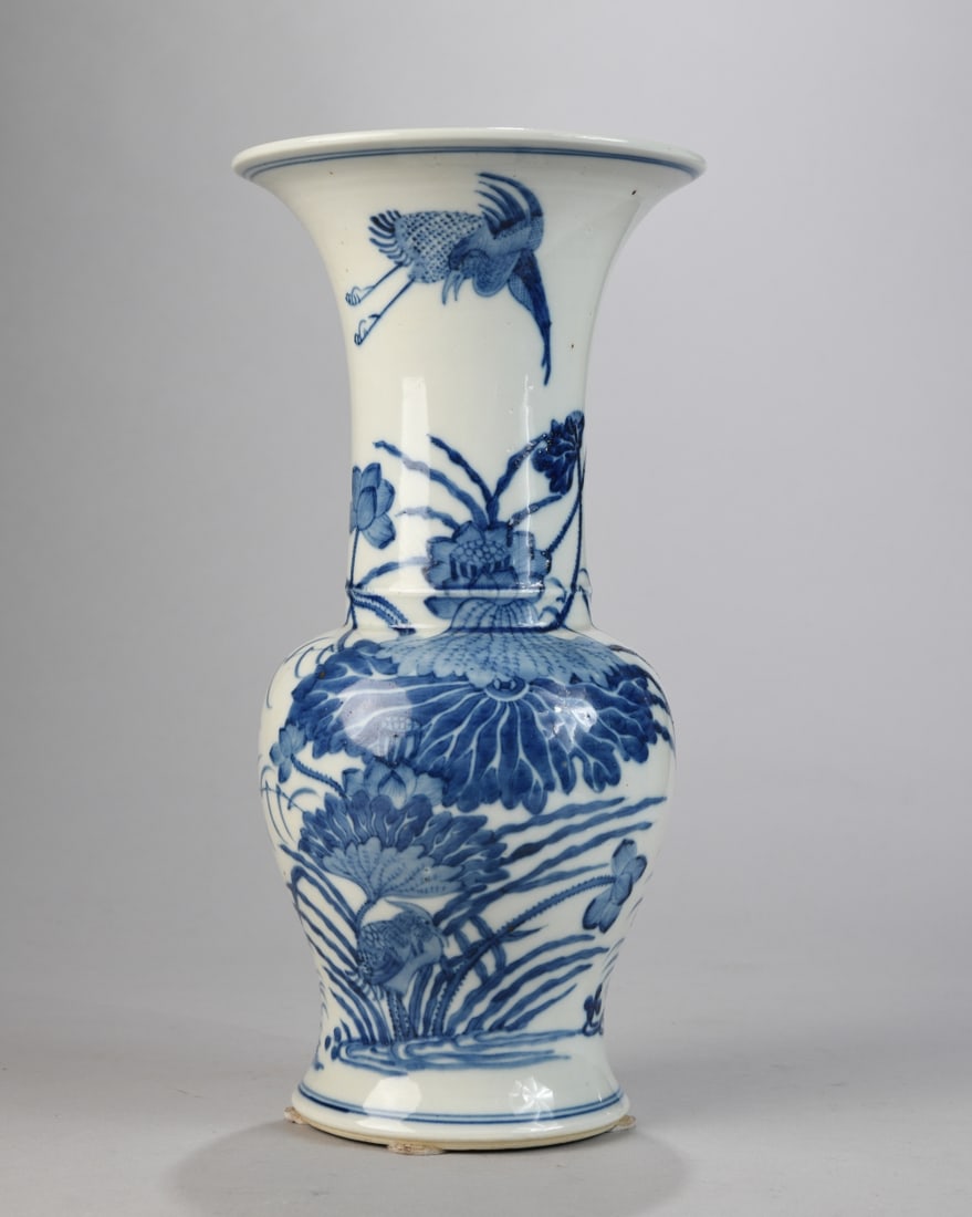 Chinese Blue and White Porcelain Vase: Baluster form with flared trumpet neck, decorated in underglaze cobalt with birds, lotus, and aquatic plants; underside with red stamped “CHINA” mark, indicating 20th century export production