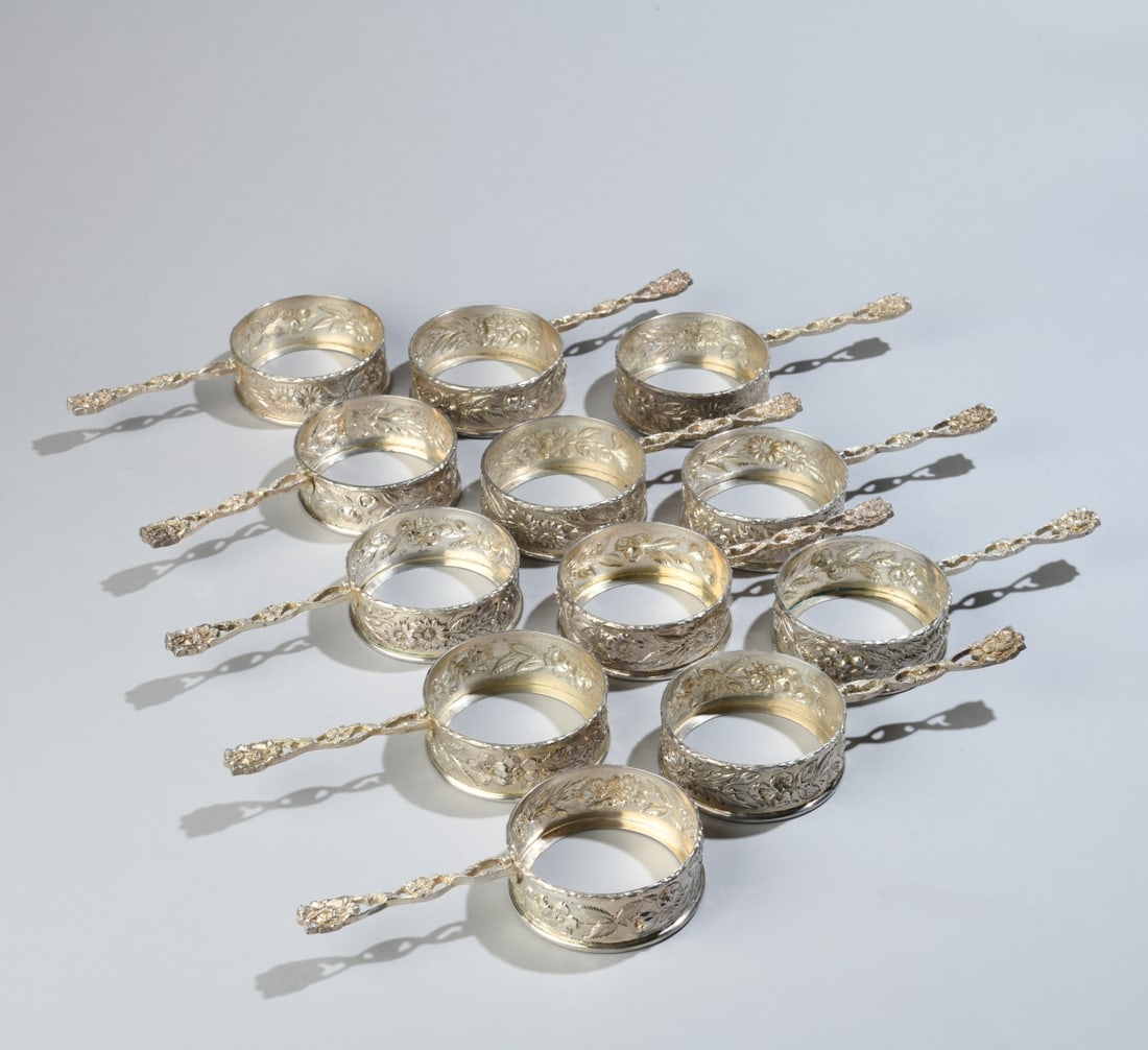Twelve S. Kirk & Son Sterling Silver Glass Holders: Monogrammed, marked to underside. L: approx. 6 1/2", Dia: approx. 3 1/8". Total weight: approx. 29.83 ozt. Our primary recommendation is to arrange shipping yourself using Blue Ridge Pack & Ship.