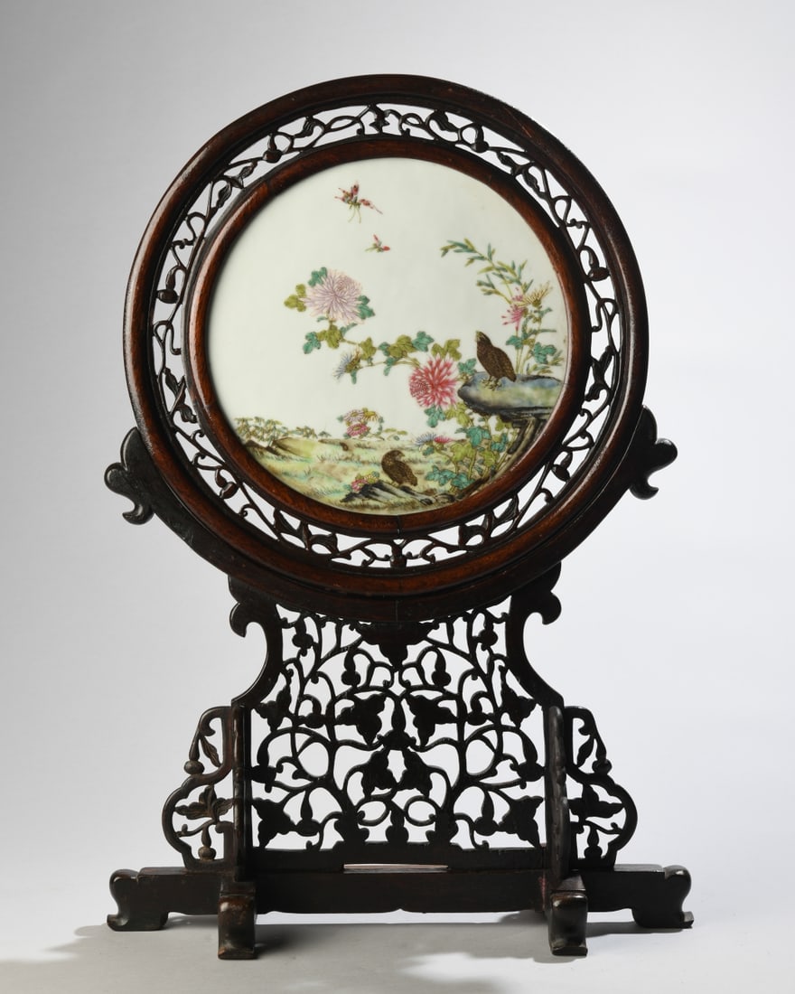 Chinese Famille Rose Porcelain Plaque Table Screen: Chinese famille rose circular porcelain plaque, finely painted with a bird and flower composition featuring flowering chrysanthemums, butterflies, and quail in a garden landscape. Mounted within an