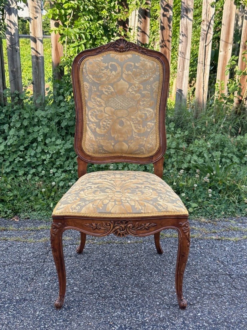 Louis XV Style Side Chair - Fortuny Fabric: A 20th century walnut finish Louis XV style side chair, upholstered in Fortuny fabric. Dimensions approx. 39 1/4" x 20 1/4" x 18 1/4". Seat height 17". Our primary recommendation is to arrange