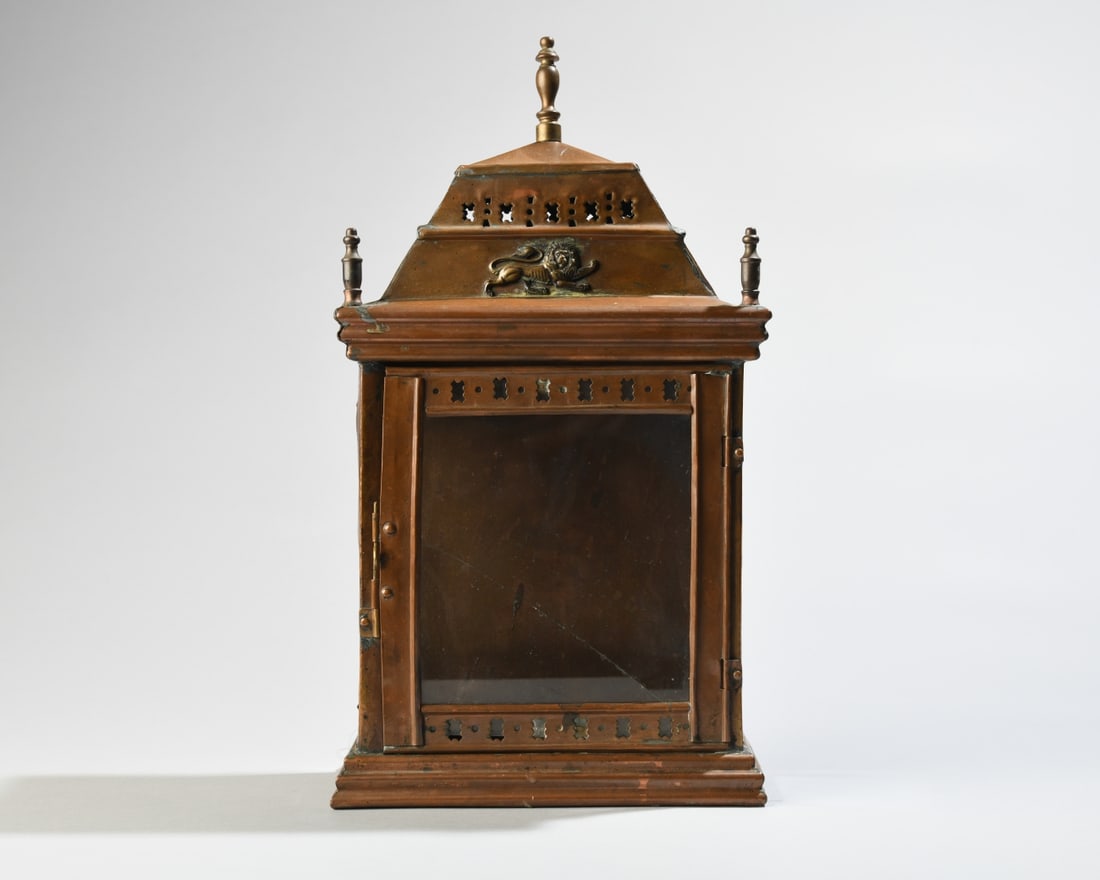 Victorian Copper Hall Lantern: Victorian copper hall lantern, late 19th century, of tapering form with glazed sides, pierced ventilation panels, and lion-form appliqué, fitted for a single candle. Wear, oxidation, repairs, and