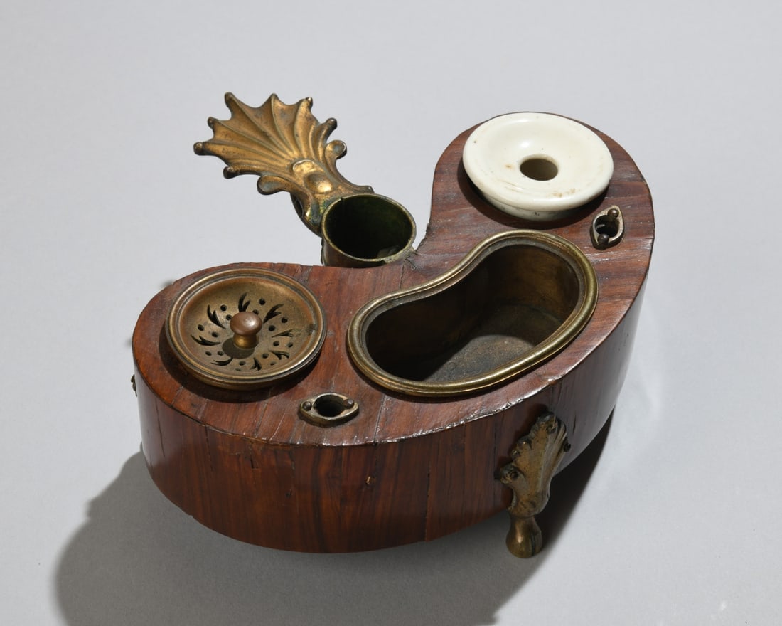 Victorian Mahogany and Brass Inkstand: Victorian mahogany and brass inkstand, late 19th century, with porcelain insert and covered brass compartment. Dimentions approx. 2 3/4" x 6" x 6 1/2". Our primary recommendation is to arrange shippin