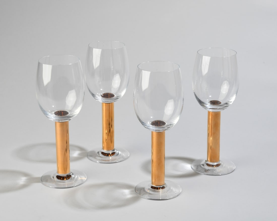 Four Orrefors Gunnar Cyren Nobel Wine Glasses: Designed by Gunnar Cyren in 1991 for the 90th anniversary of the Nobel Prize. Made of crystal with hand painted details in 21k gold, maker's mark etched to underside. Dimensions approx. 8 1/2" x 3