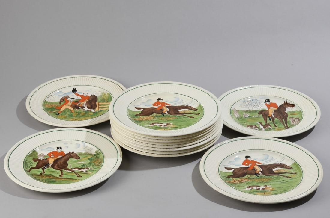 Twelve Wedgwood Edme Plates: Decorated with hunt scenes surrounded by green border, all marked to underside, two with chips/cracks. Diameter approx. 9". Our primary recommendation is to arrange shipping yourself using Blue Ridge