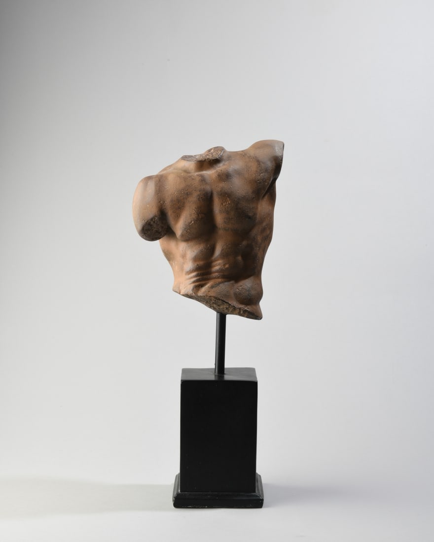 Cast Resin Male Torso Sculpture: Mounted to stand, faux terracotta finish, modeled as a classical figure with muscular anatomy, unsigned. Total H: approx. 18 1/4" x 7" x 4 1/2". Our primary recommendation is to arrange shipping