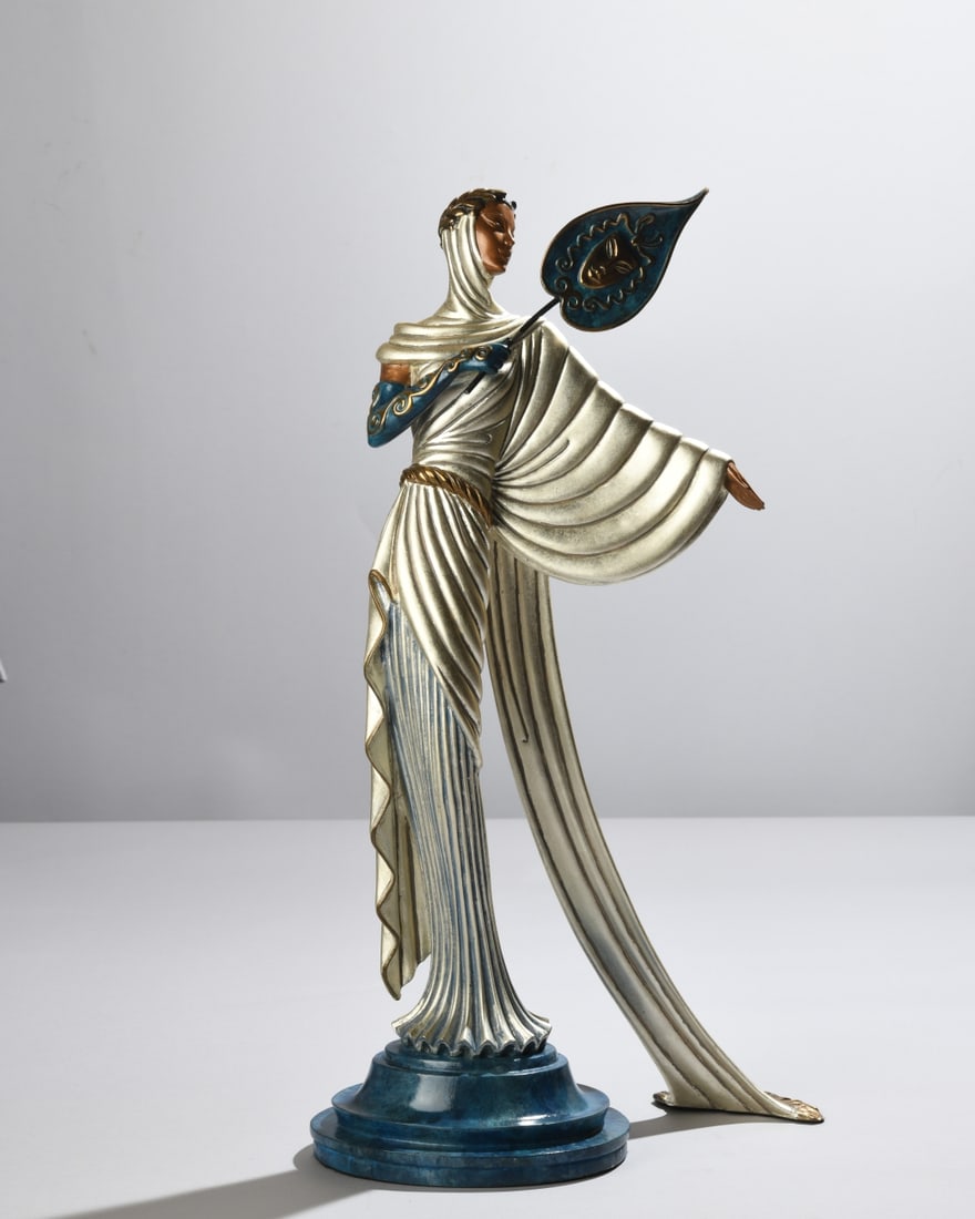Erte (Romain de Tirtoff, 1892-1990) Tanagra: Cold painted bronze figural sculpture with silvered drapery, gilt accents, and blue patinated details, depicting a stylized female figure holding a theatrical mask. Published by Dyansen Corporation,