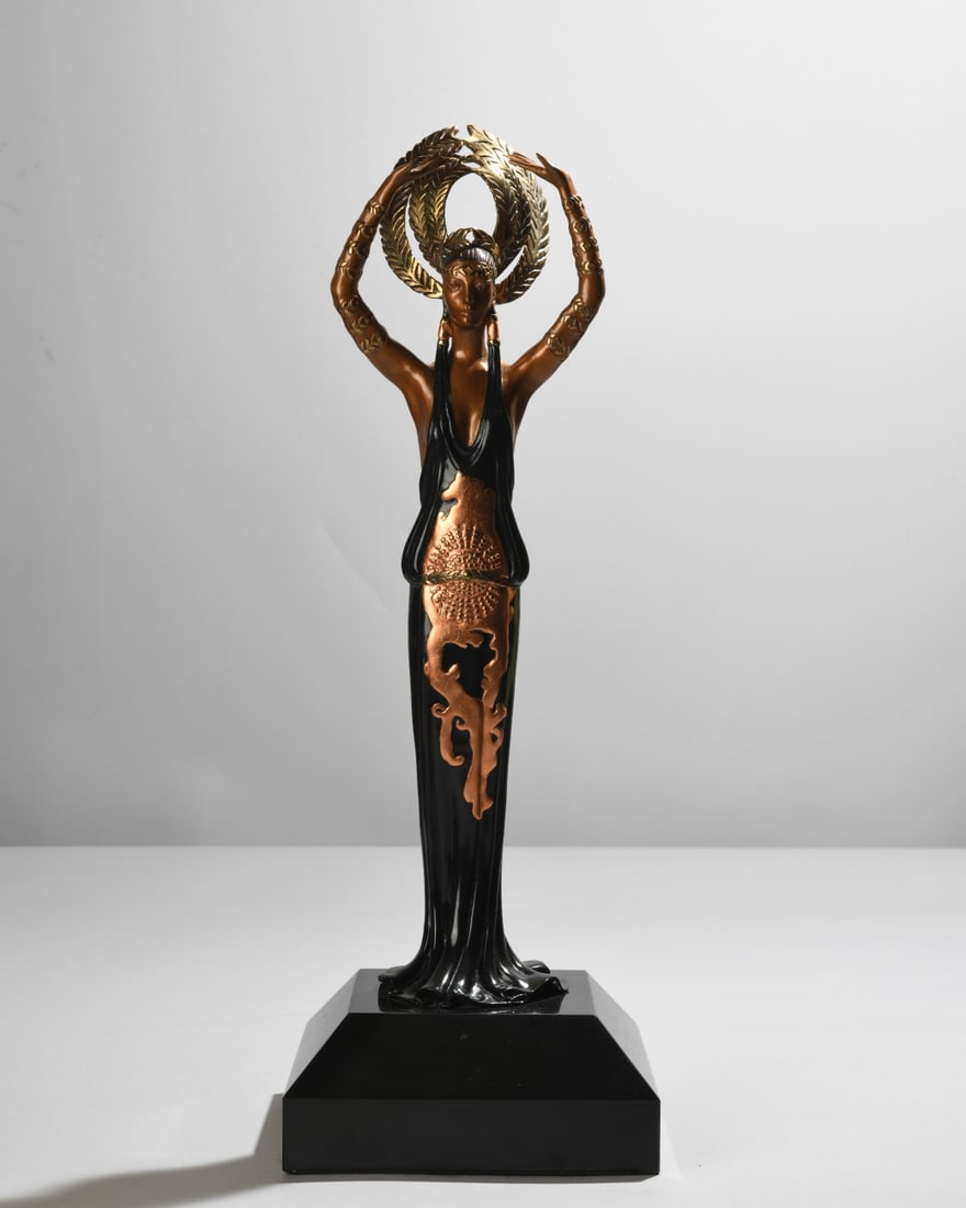 Erte (Romain de Tirtoff, 1892-1990) Triumph: Patinated bronze sculpture with black and gilt patina, cast by Chalk & Vermilion Fine Arts after a 1987 design, depicting an elegant standing female figure holding a laurel wreath overhead, mounted