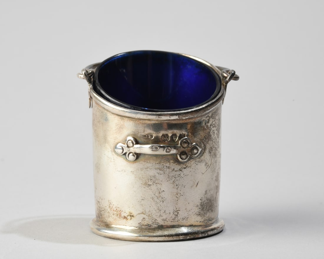 Victorian Sterling Silver Salt Scuttle: No monograms, with cobalt blue glass liner, marked for J B (Joseph Braham, London) with date mark partially obscured. Weight (not including glass liner): approx. 2.05 ozt. Our primary recommendation
