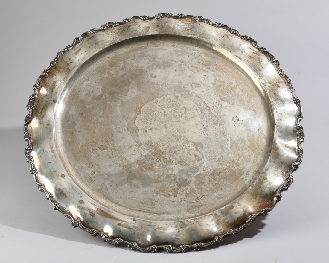 Mexican Sterling Silver Footed Serving Tray: With scrolling foliate rim, marked to underside, some surface wear. Dia: approx. Weight: approx. 80.53 ozt. Our primary recommendation is to arrange shipping yourself using Blue Ridge Pack & Ship.