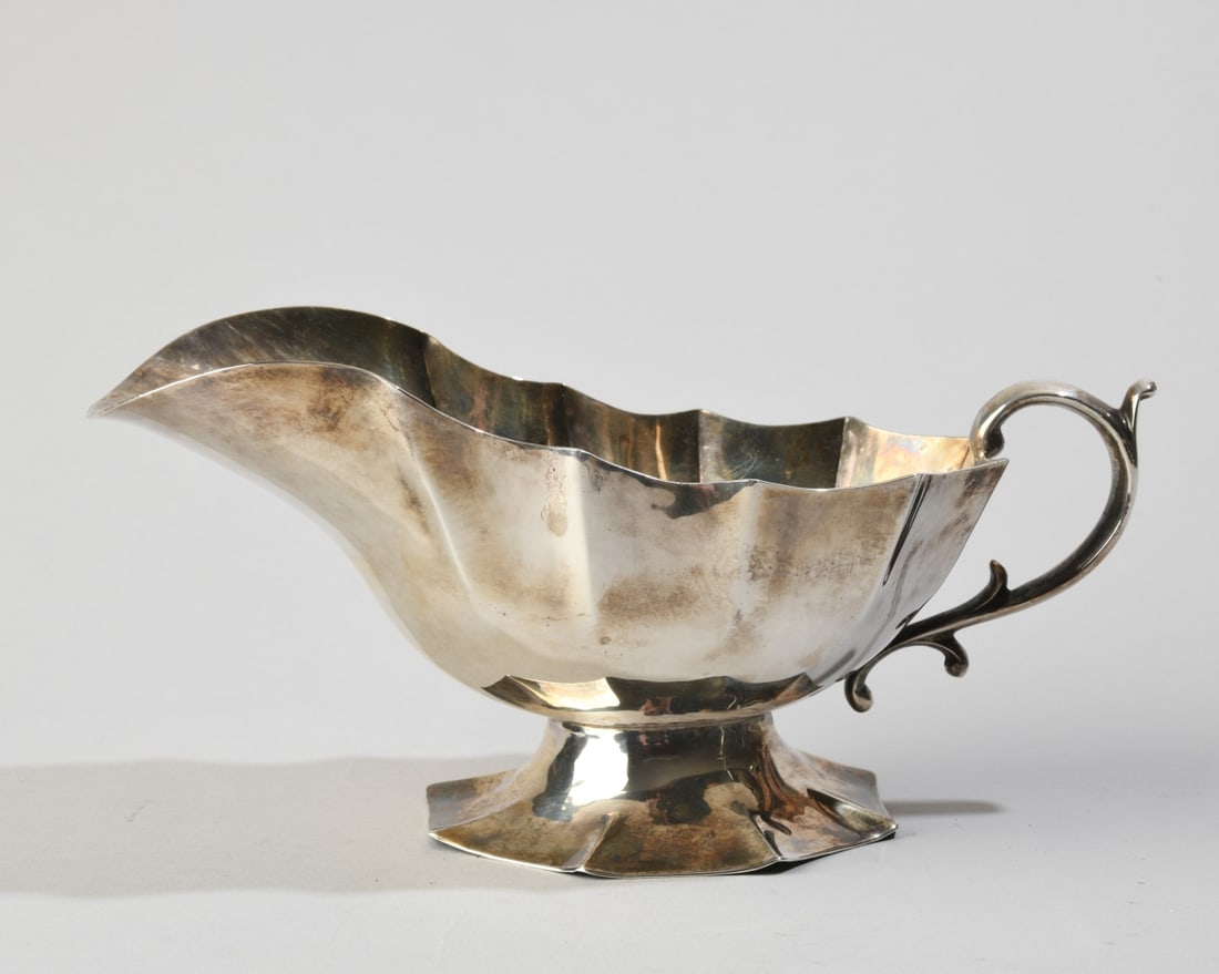 Sterling Silver Sauce Boat: No monograms, marked to underside. Approx. 4 1/4" x 9 1/4" x 4 1/8". Weight: approx. 13.82 ozt. Our primary recommendation is to arrange shipping yourself using Blue Ridge Pack & Ship. Most bidders