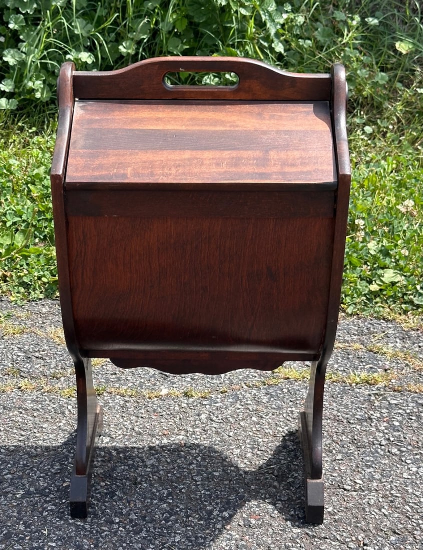 Vintage Sewing Stand: Floor standing sewing cabinet in the colonial revival taste, shaped carrying grip, hinged lid opens to storage with divided tray. Approx. 23" x 13" x 11". Our primary recommendation is to arrange