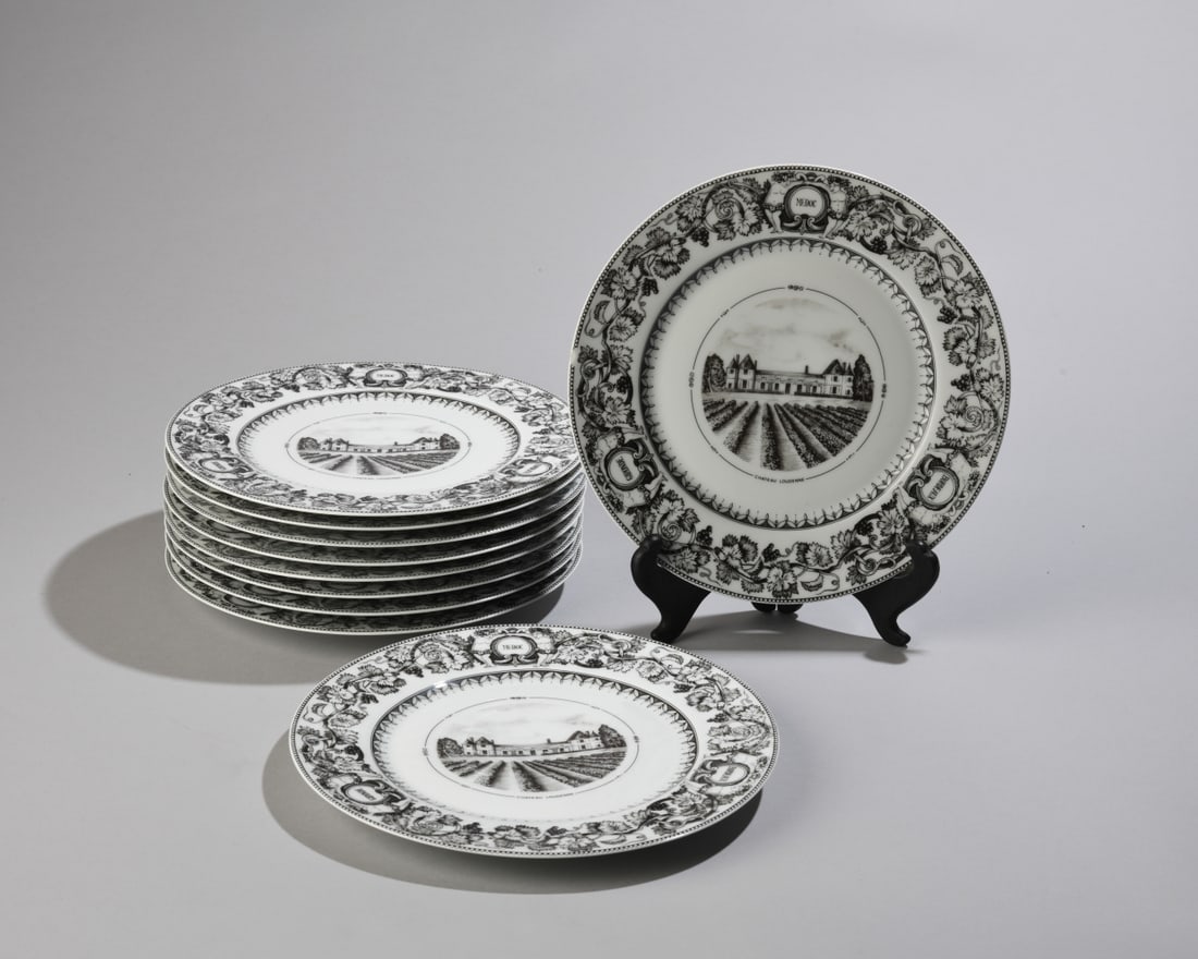 Set of 10 Limoges Plates, Chateau Loudenne Winery: Decorative Limoges porcelain plates, featuring Chateau Loudenne winery in center and border with grapevine motif. One with chip to rim. Dimensions approx. 8 3/4" dia. Our primary recommendation is to