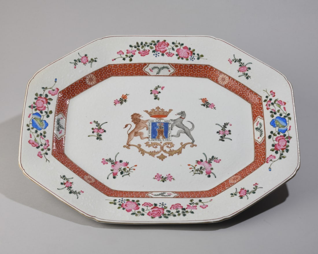 Armorial Ironstone Serving Platter: Octagonal form, armorial crest at center featuring lion and hound, surrounded by floral decoration. No maker's mark. No visible chips, cracks, or repairs. Dimensions approx. 18 1/4" x 14 3/4". Our